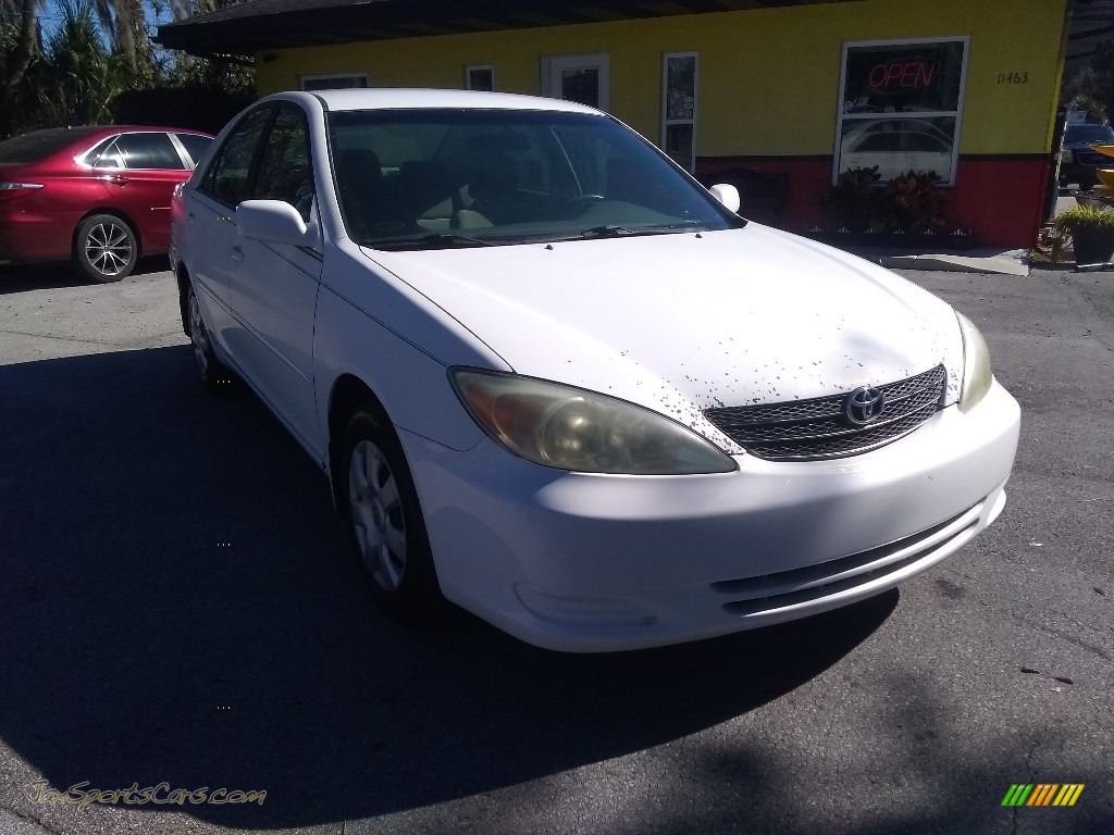 Super White / Taupe Toyota Camry LE