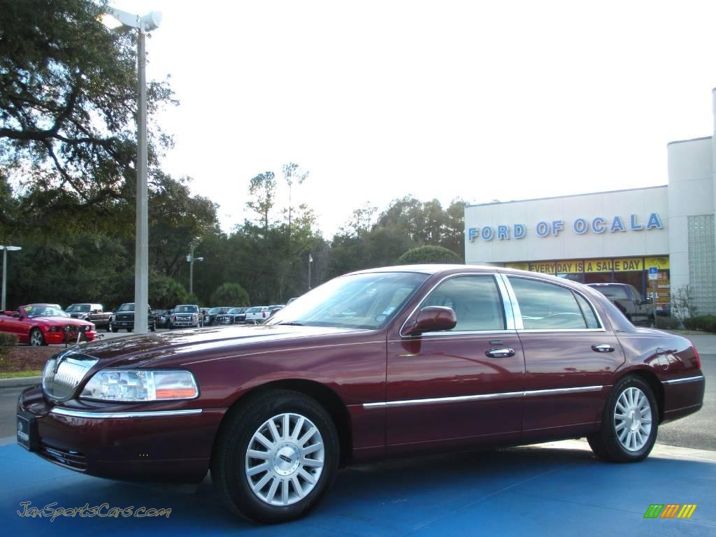Autumn Red Metallic / Medium Dark Parchment/Light Parchment Lincoln Town Car Signature